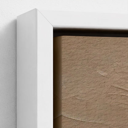 Close-up of a white frame corner with a textured beige wall background
