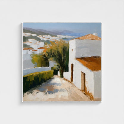 Framed painting of a village scene with white houses and green trees.