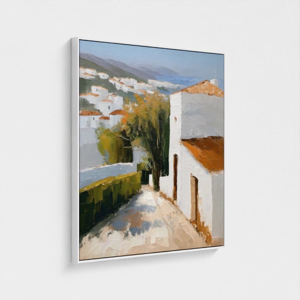Framed painting of a coastal village scene with white houses and greenery.
