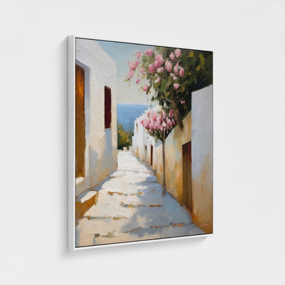 Framed artwork of a sunlit street with white buildings and pink flowers.