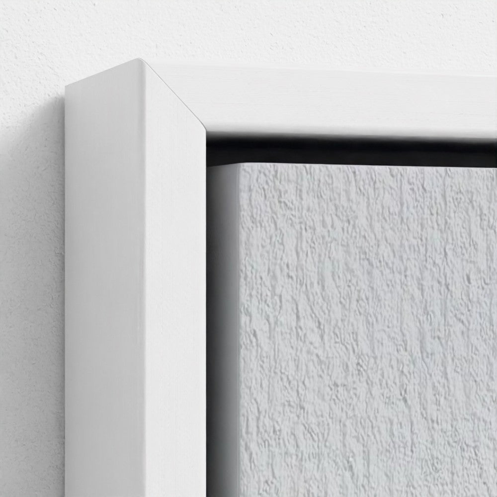Close-up of a white frame corner on a textured white background