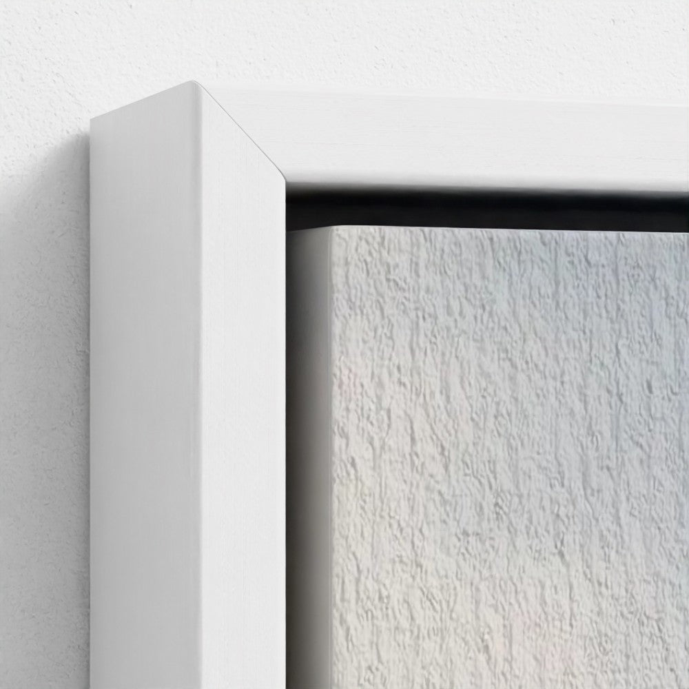 Close-up of a white frame corner on a textured white background
