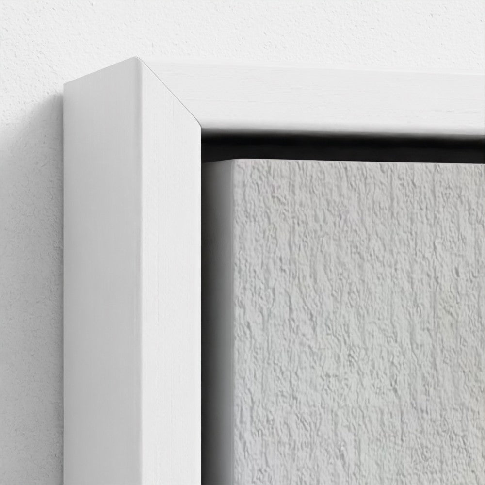 Close-up of a white frame corner with a textured white background