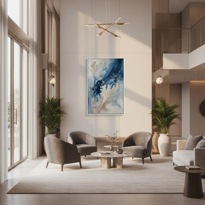 Modern living room with gray chairs, a coffee table, and a decorative painting on the wall.