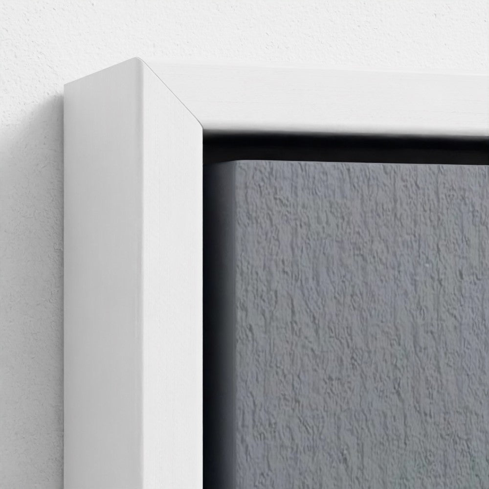 Close-up of a white frame corner with a textured gray background