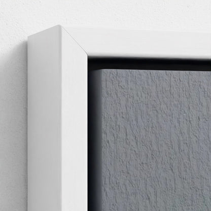 Close-up of a white frame corner with a textured gray background