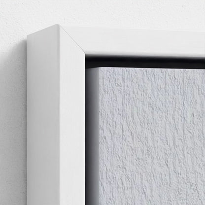 Close-up of a white frame corner on a textured white background