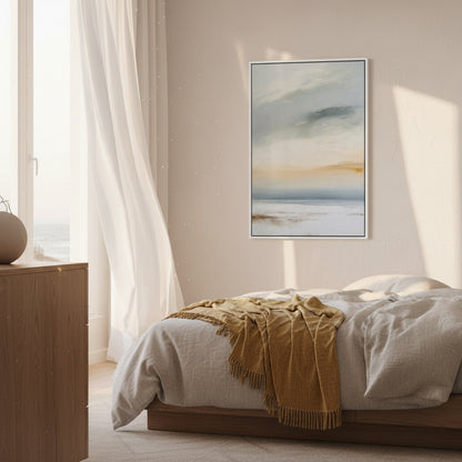 Bedroom with a bed, yellow blanket, wooden side table, and abstract art on the wall.