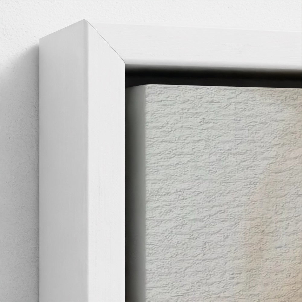 Close-up of a textured white canvas with a white frame on a light gray background