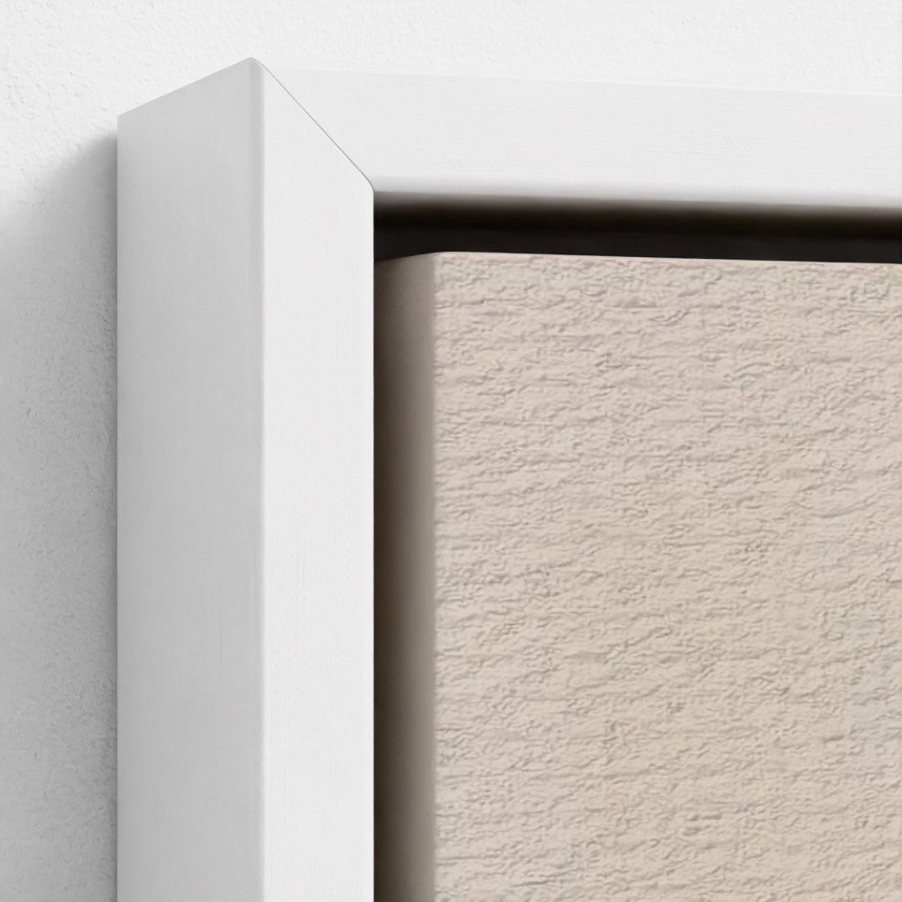 Close-up of a white frame corner with a textured beige background