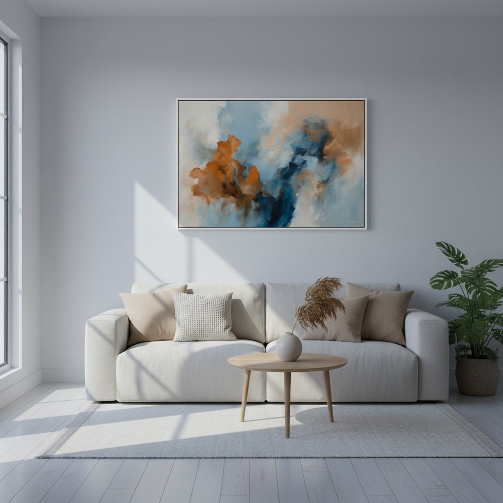 Modern living room with a white sofa, abstract painting, and plant.