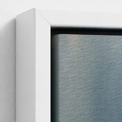 Close-up of a white frame corner with a textured blue background