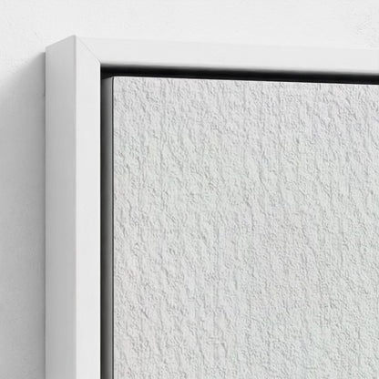 Close-up of a textured white wall with a black frame corner.