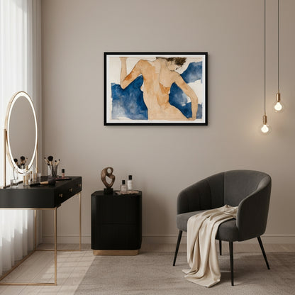 Modern interior with a black desk, gray chair, and framed artwork on a beige wall.