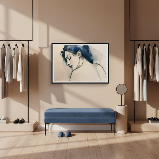 Modern interior with a blue bench, framed artwork, and clothing racks.