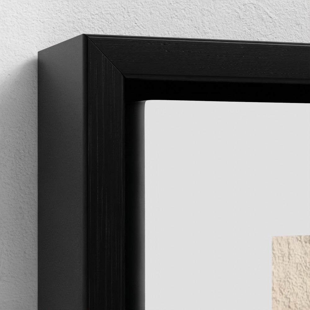 Close-up of a black picture frame on a white wall