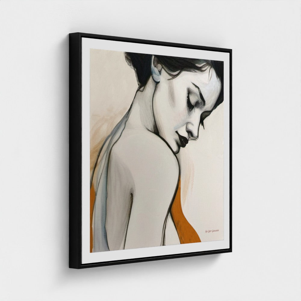 Framed artwork of a stylized portrait on a white wall