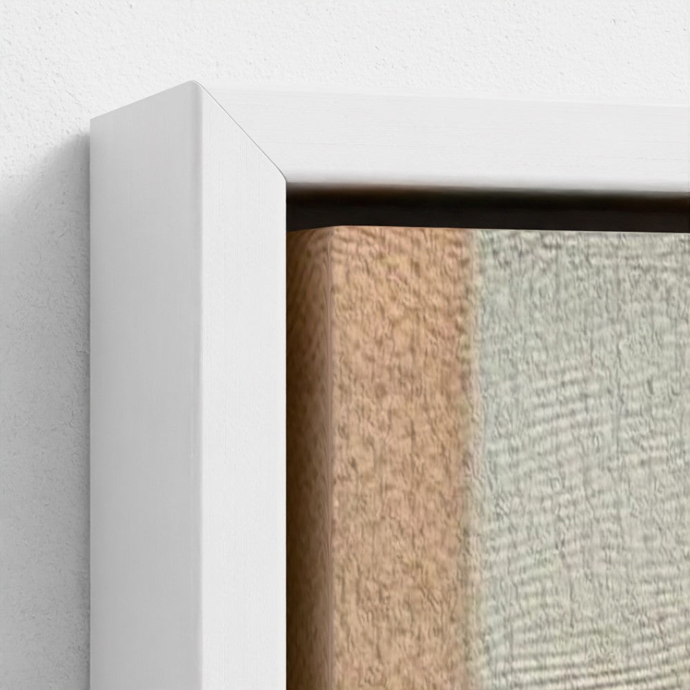 Close-up of a textured wall with a white frame.
