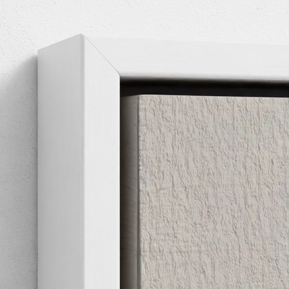 Close-up of a textured white wall with a white frame corner.