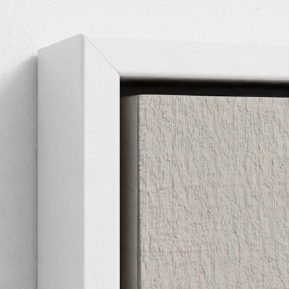 Close-up of a textured white wall with a white frame corner.