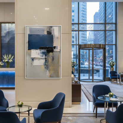 Modern interior of a hotel lobby with abstract art, blue chairs, and city view.