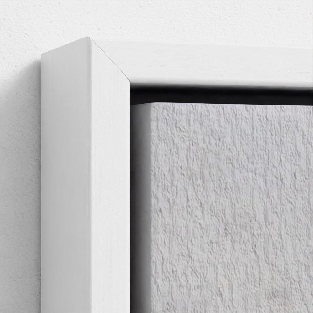Close-up of a white frame corner on a textured white background