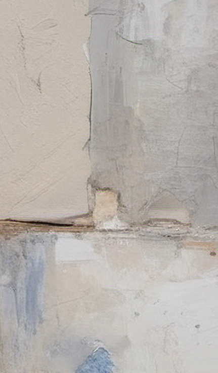 Close-up of a textured wall with a crack running vertically.