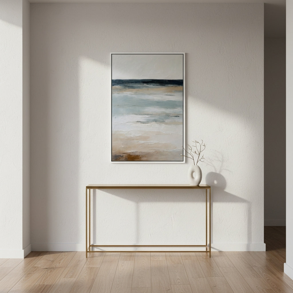 Framed abstract painting on a wall above a console table with a vase.