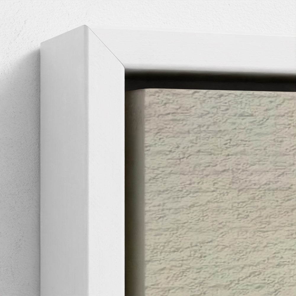 Close-up of a textured wall with a white frame.