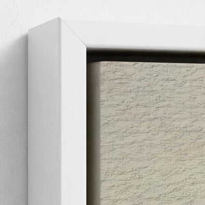 Close-up of a textured wall with a white frame.