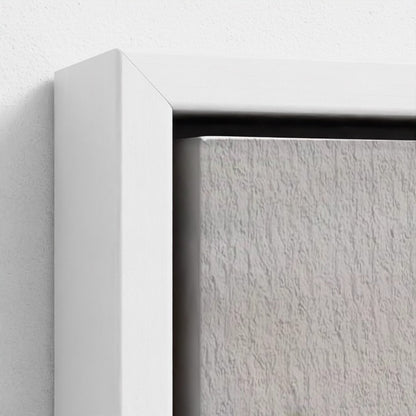 Close-up of a white frame corner on a textured white surface