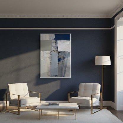 Modern living room with white chairs, a coffee table, and abstract art on a dark blue wall.