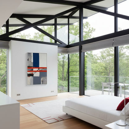 Modern bedroom with large windows, white bed, and abstract art on wall.