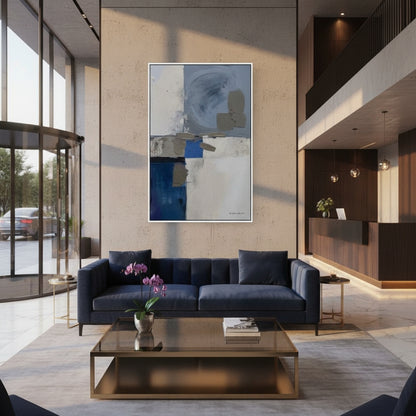 Modern living room with a blue sofa, abstract painting, and glass coffee table.