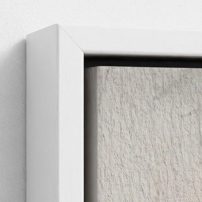 Close-up of a white frame corner with a textured gray background
