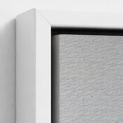Close-up of a white frame corner on a textured white background