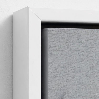 Close-up of a white frame corner on a textured gray background