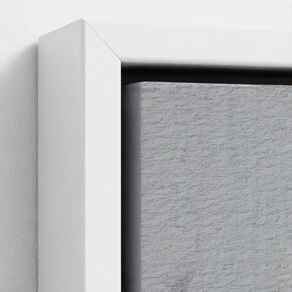 Close-up of a white frame corner on a textured gray background