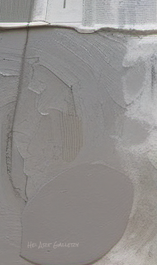 Close-up of a textured gray surface with a visible brand name.