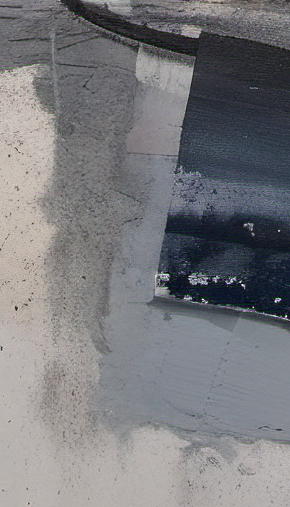 Close-up of a concrete surface with a crack and some debris.