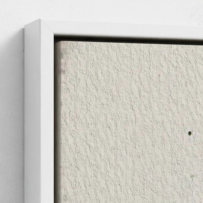 Close-up of a textured white wall with a minimal white frame.