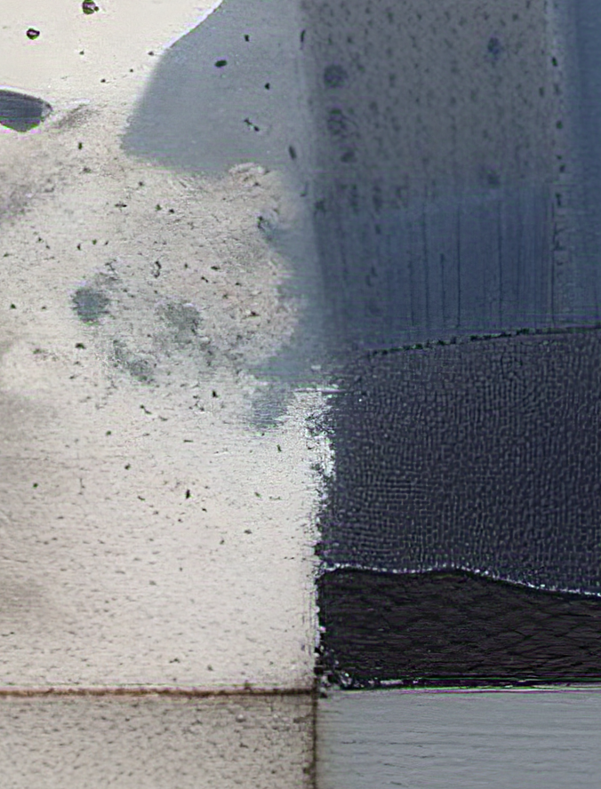 Close-up of a textured surface with a dark blue fabric strip