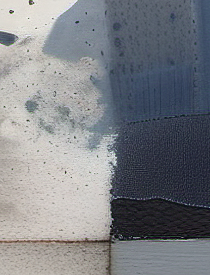 Close-up of a textured surface with a dark blue fabric strip