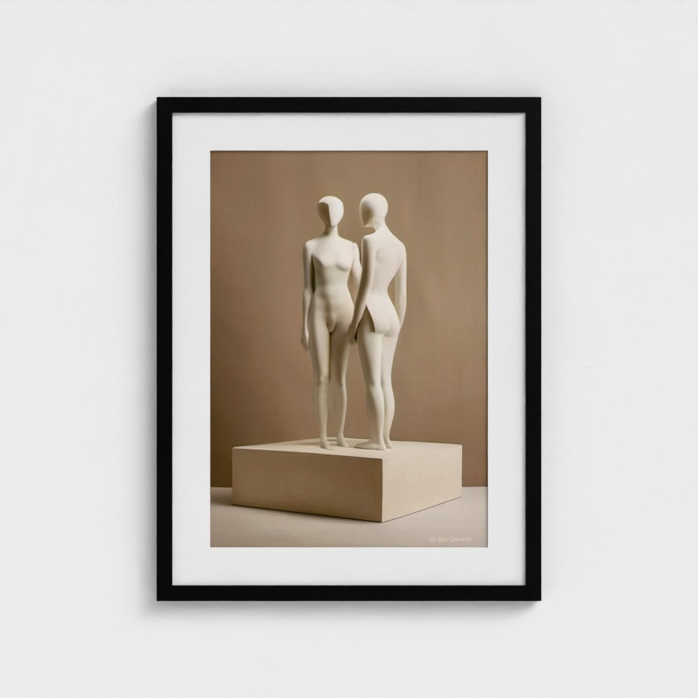 Framed artwork of two abstract sculptures on a beige platform against a beige wall.