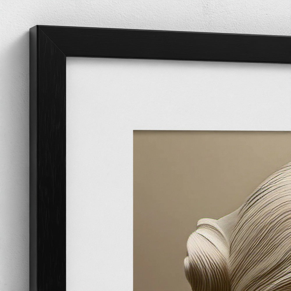 Close-up of a black framed artwork with a beige background
