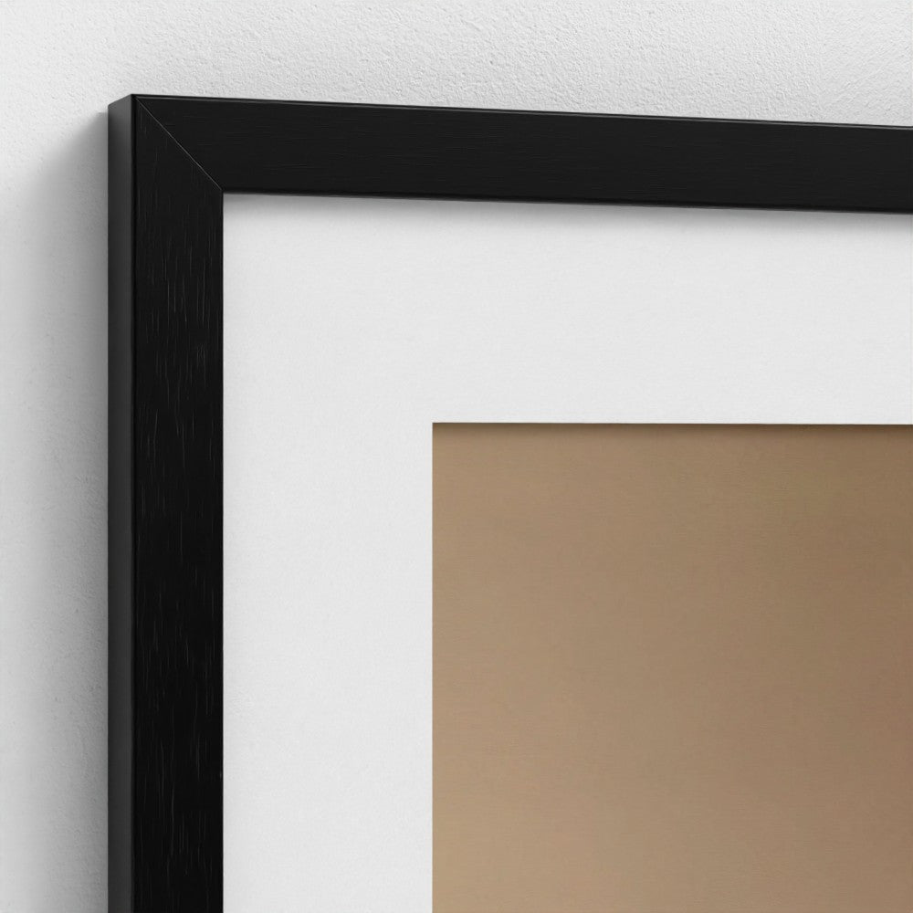 Close-up of a black picture frame on a white wall with a brown paper background.