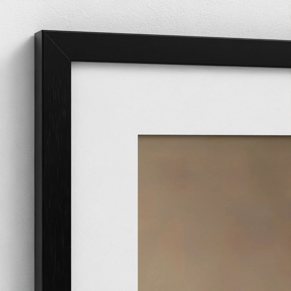 Close-up of a black picture frame on a white wall