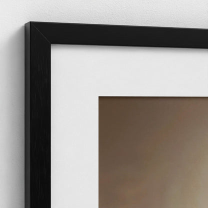Close-up of a black picture frame on a white wall