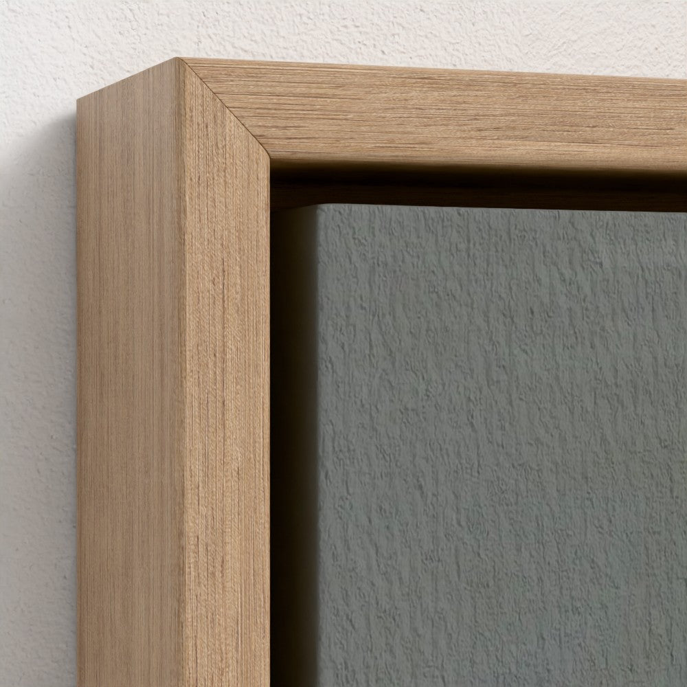 Close-up of a wooden frame on a gray wall