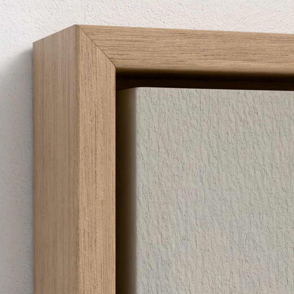 Close-up of a wooden picture frame on a white wall